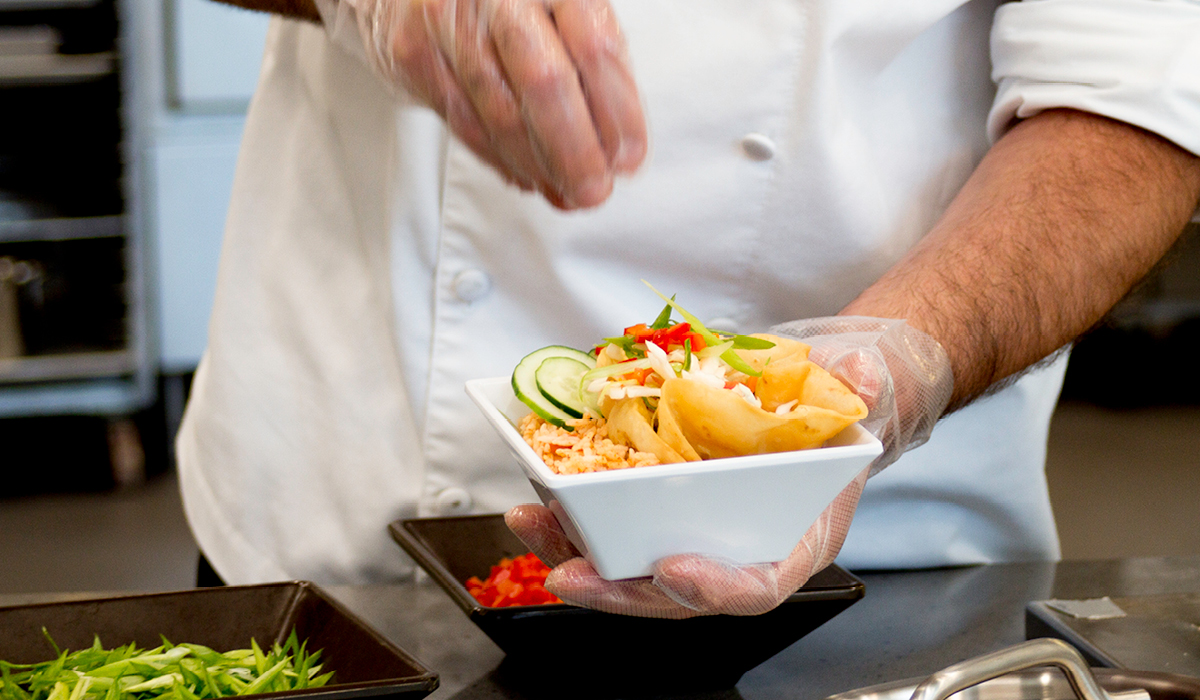 Chef preparing food bowl